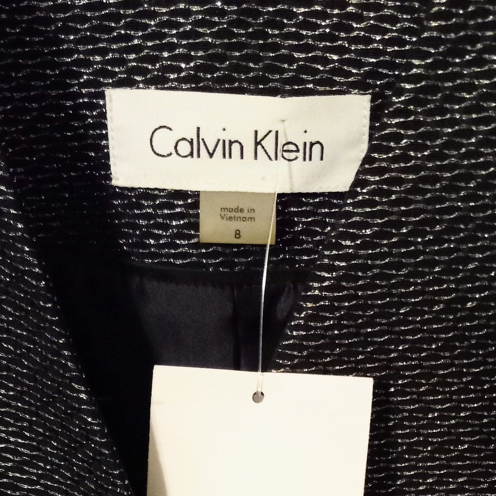 Calvin Klein Jacket. Size 8 ladies. Black w silver threads.